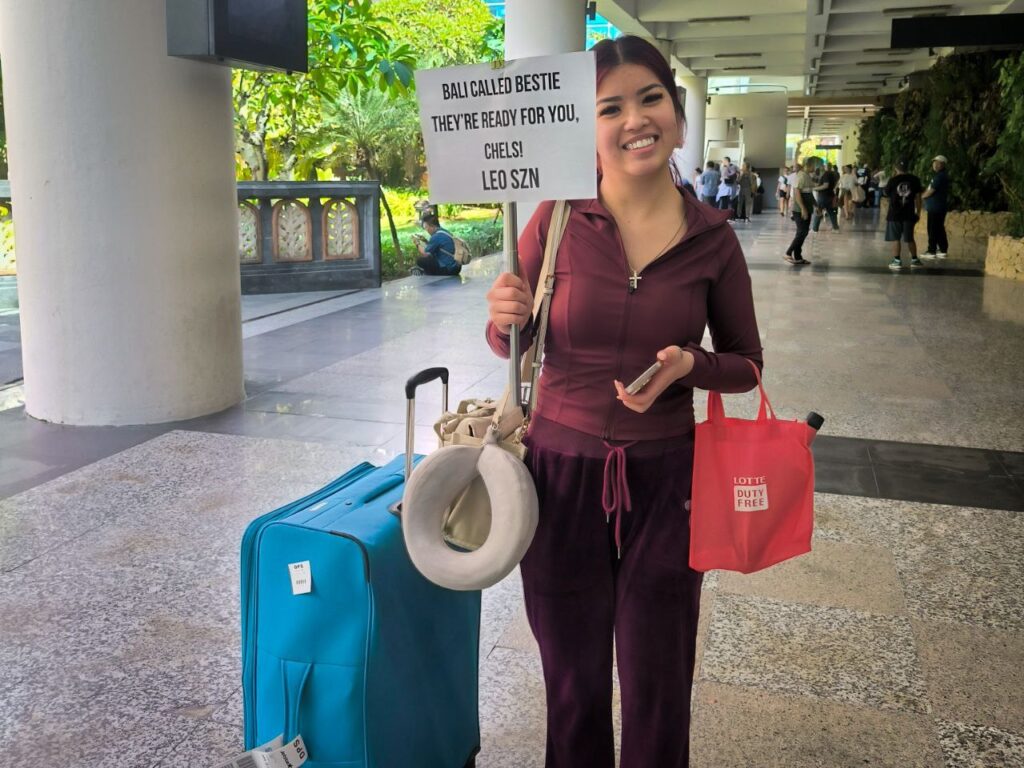 Tourist arriving at Ngurah Rai Airport using Bali private driver service.