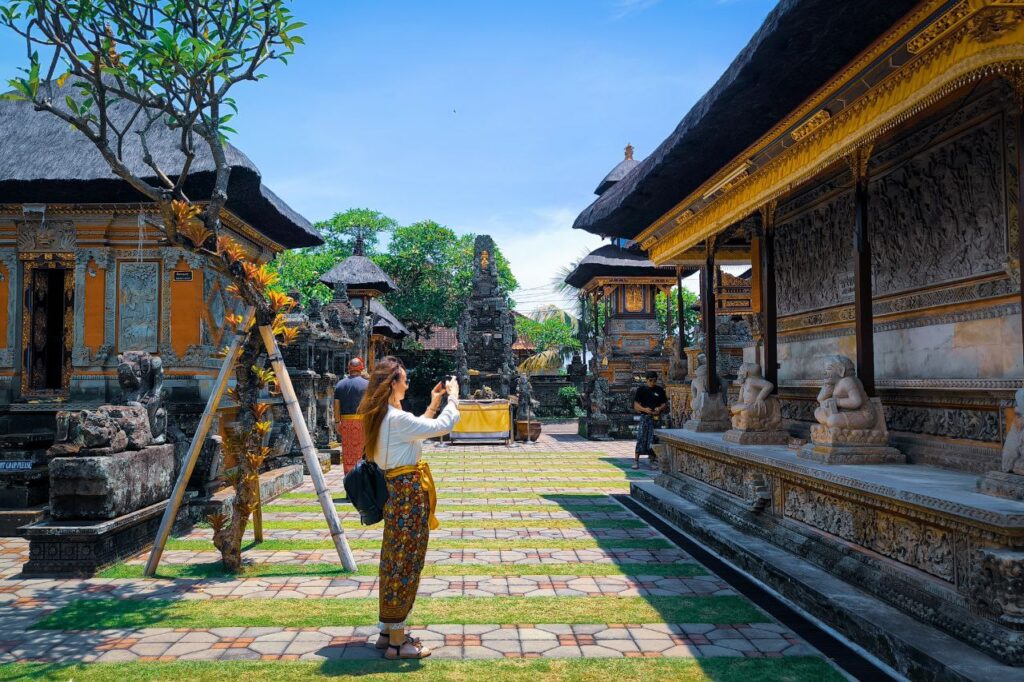 Traveler visiting Batuan Temple guided by Ubud Private Driver in Bali