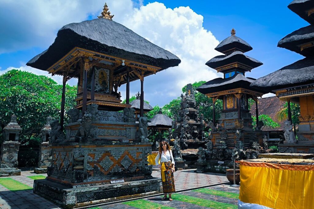 Exploring the inner courtyard of Batuan Temple with Ubud driver service