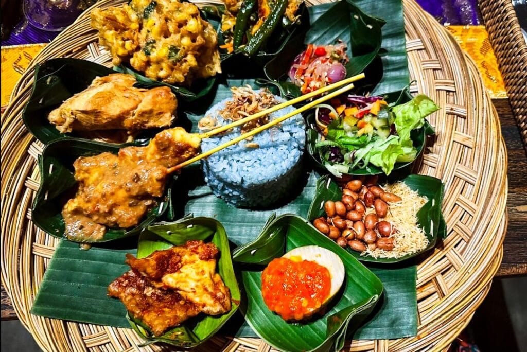 nasi campur Bali with traditional dishes at local warung