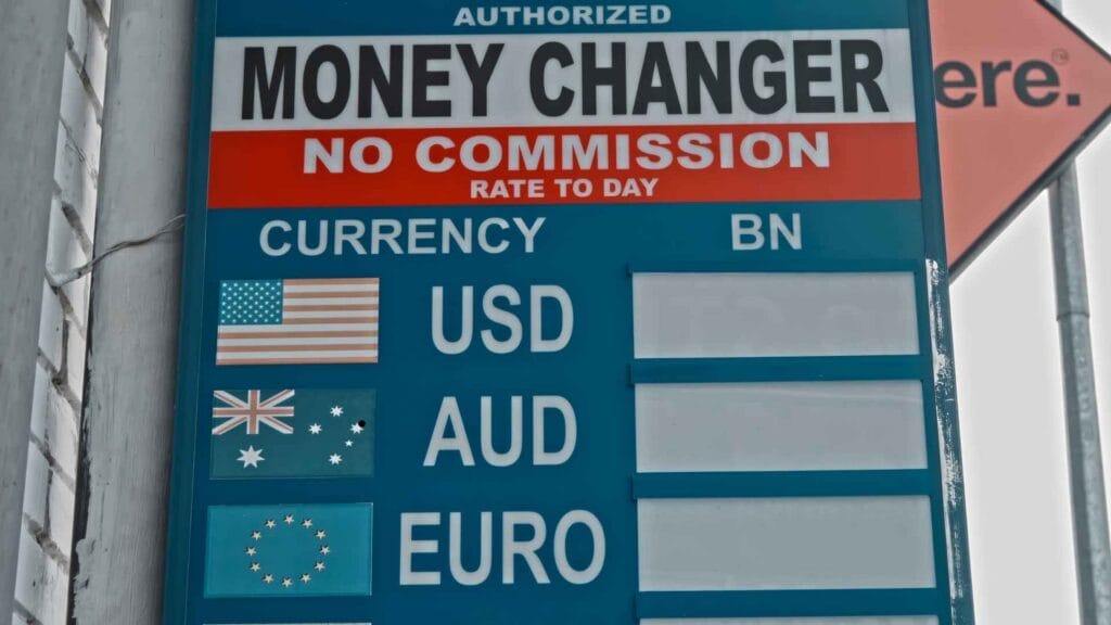 Tourist exchanging Bali currency at authorized money changer