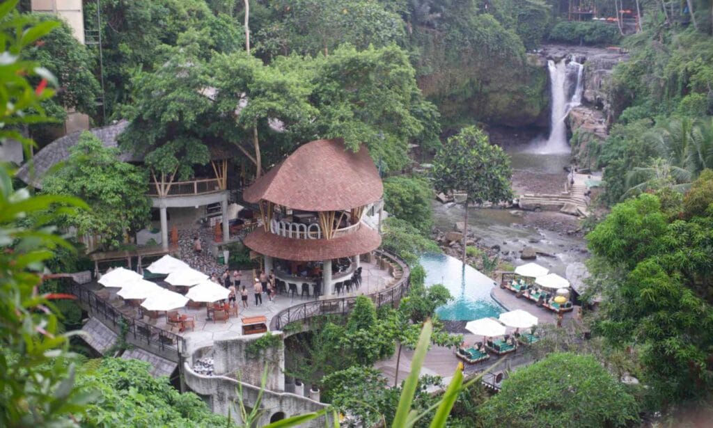 Omma Waterfall Bali infinity pool with Tegenungan Waterfall jungle view