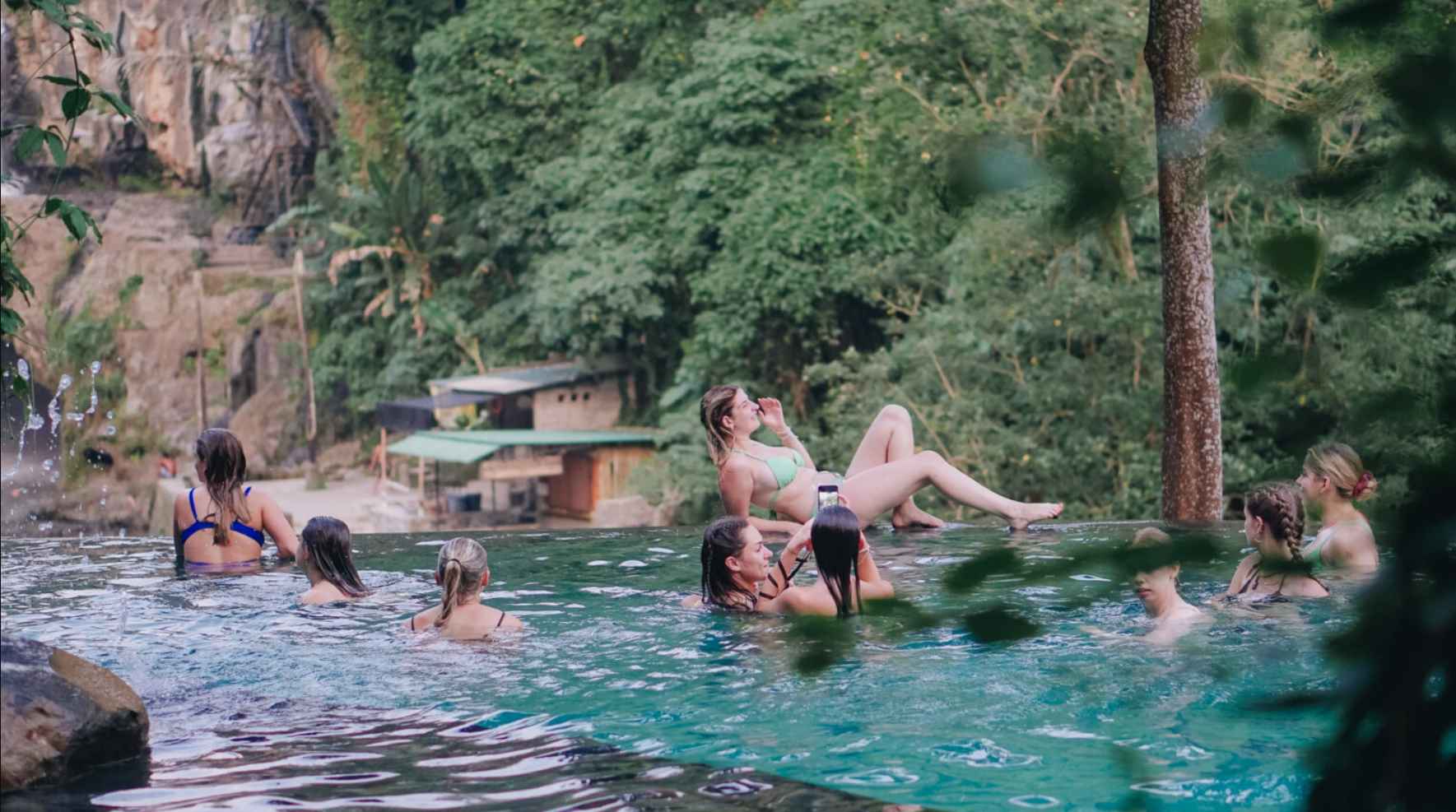 Luxury day club at Omma Waterfall Bali overlooking Tegenungan Waterfall and lush jungle