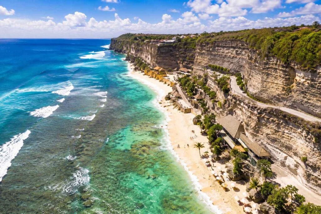 Beautiful sunset at Melasti Beach Bali with tropical beach atmosphere and golden sky