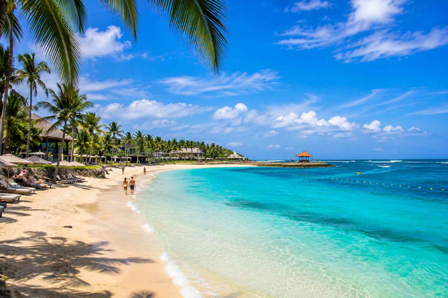 Nusa Dua Beach Bali during sunrise featuring white sand beach and luxury resort coastline