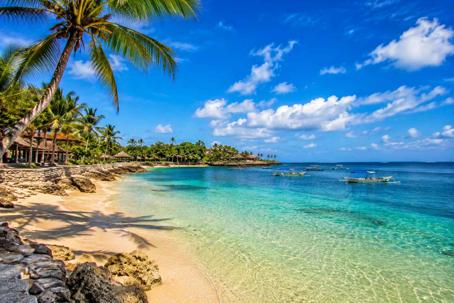 Scenic sunrise at Nusa Dua Beach Bali showcasing white sand, calm water, and tropical atmosphere